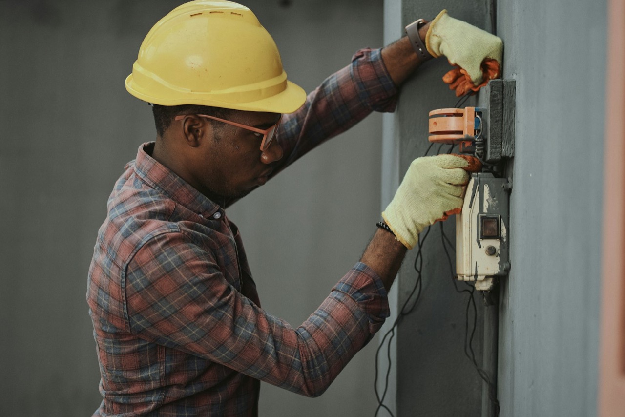 Van Ess electrician servicing an electrical panel